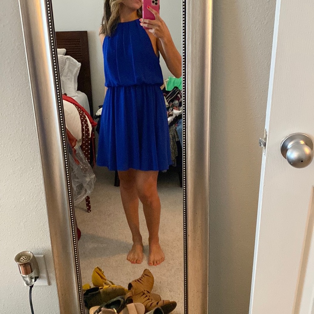 Open in the back. Beautiful Blue dress. Size Small